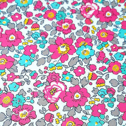 Estampado Liberty en flores rosa fucsia y azul turquesa